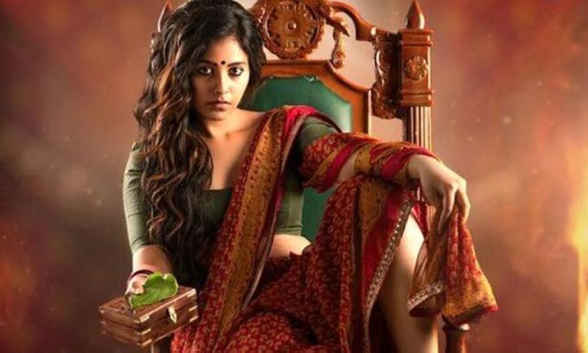 Actress Anjali sitting in a chair