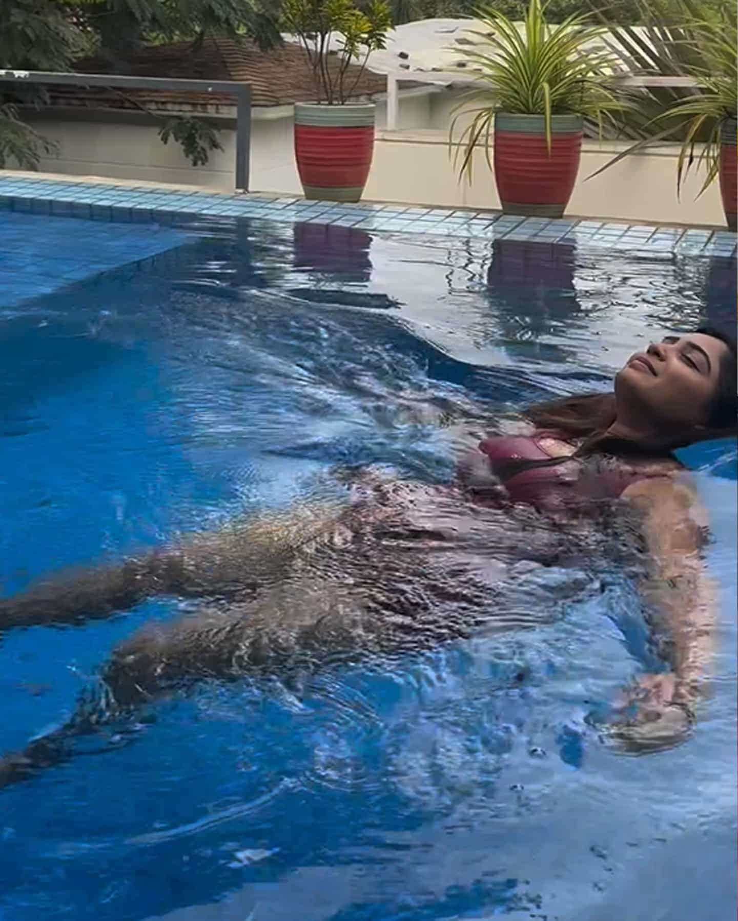 Gauri Kishan Kummalam with her hand after the wedding.. in a tiny swimming suit.